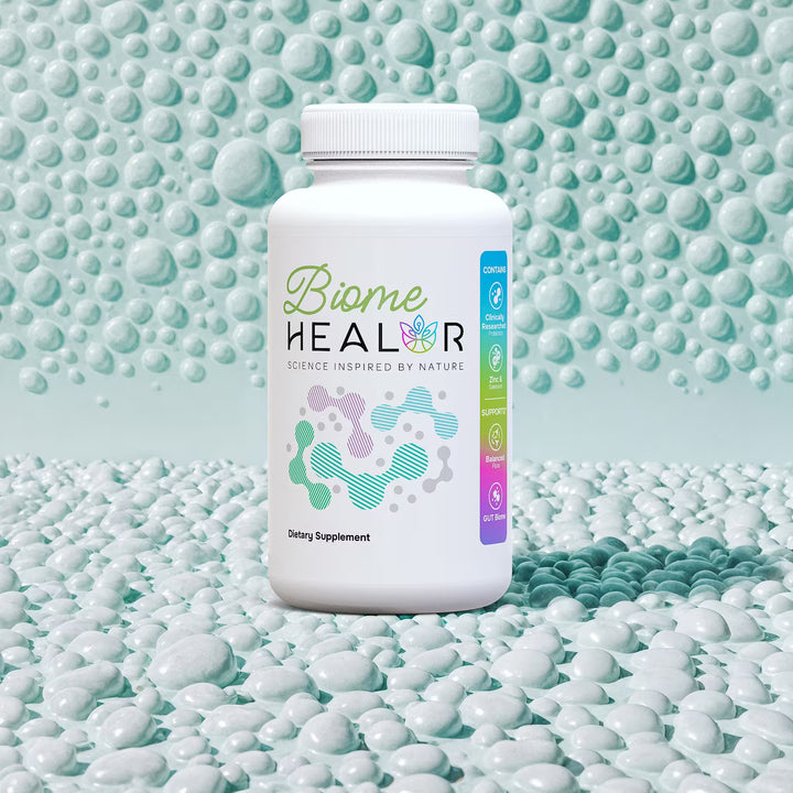 Supplement bottle labeled 'Biome Healer' on a textured green background