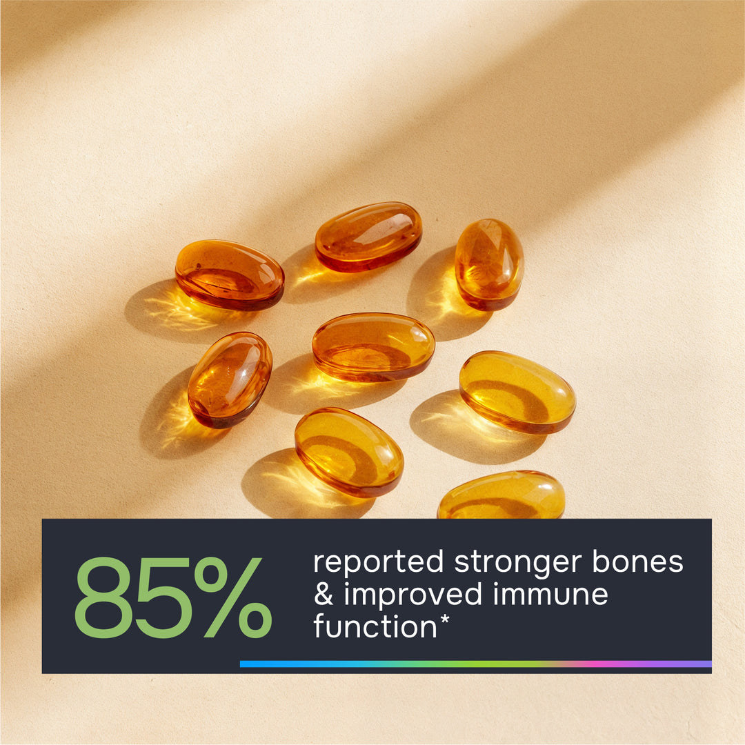 Orange gel capsules on a beige background with text about bone strength and immune function.