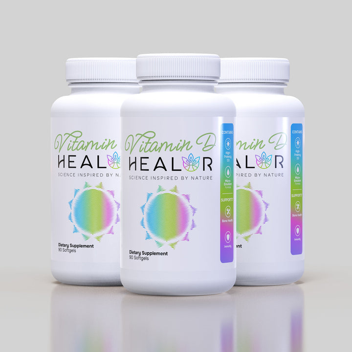 Three bottles of Vitamin D HEALOR on a gray background