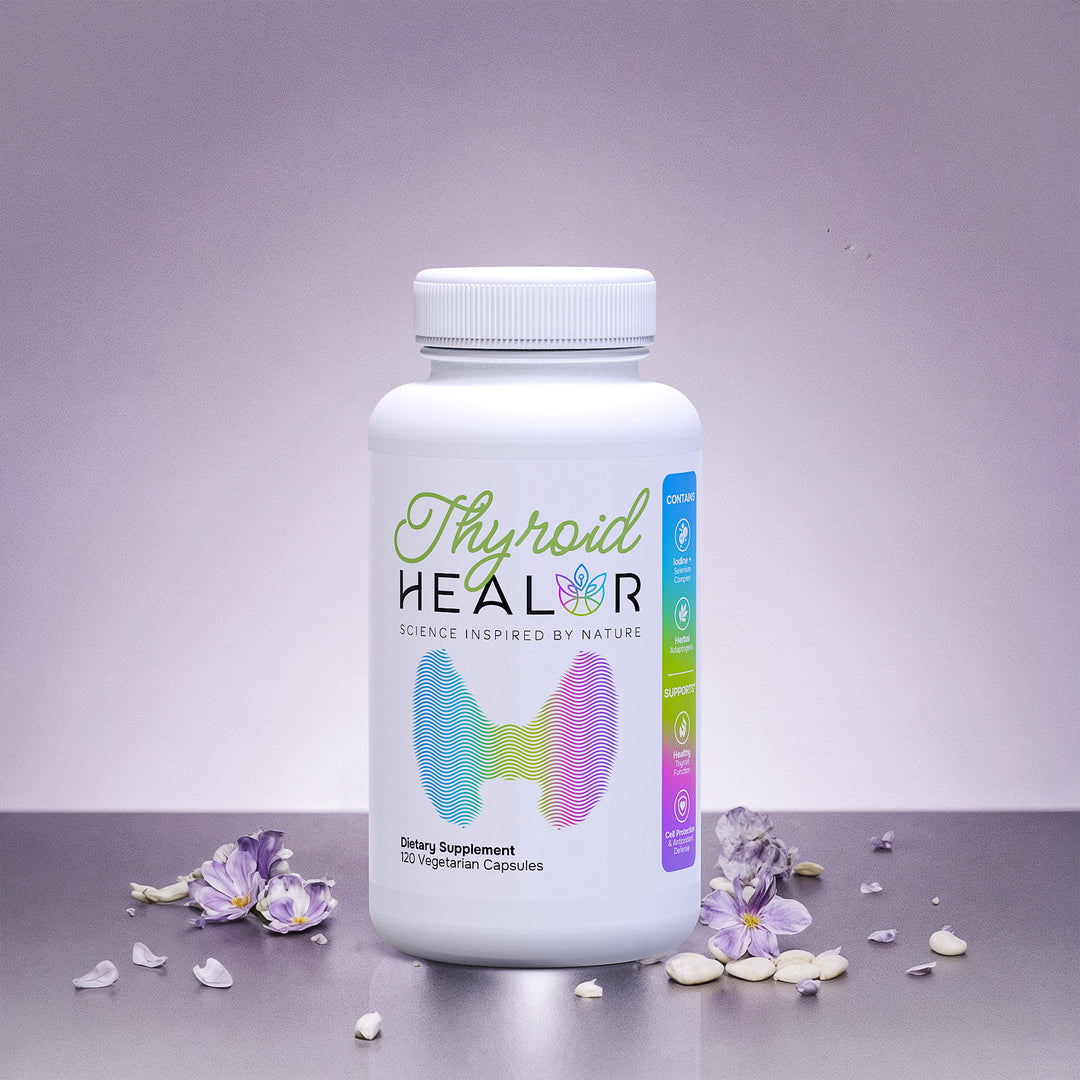 Thyroid Healor supplement bottle on a gray surface with purple flowers